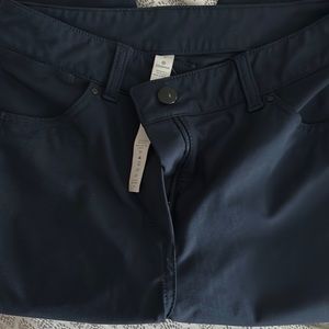 Navy blue size 4 lululemon trouser straight leg pants. They do fit more like a 2